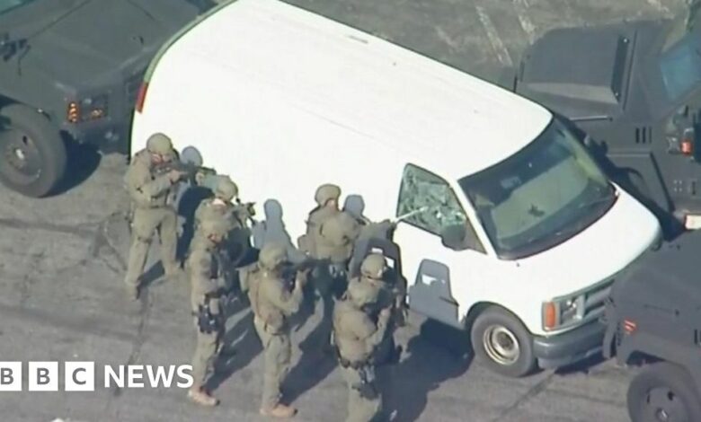 Monterey Park shooting: Armed police enter white van